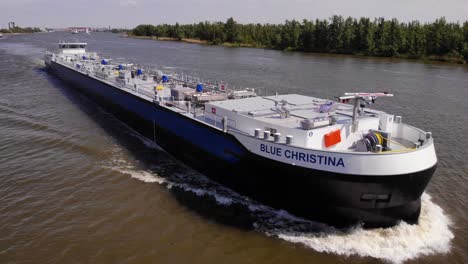 Blue-Christina-Tanker-Vessel-Cruising-In-The-Oude-Maas-In-Zwijndrecht,-Netherlands