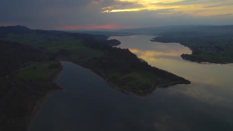Man-Made-Lake-Czorsztyn-on-Sunset,-Aerial-Drone-View-Backwards-Shot