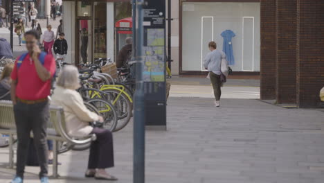 Random-people-walking-in-streets-of-Kingston-upon-Thames,-slow-motion-view