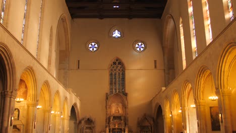 Looking-up-aisle-and-interior-of-historic-and-famous-Santa-Chiara-Church-in-Naples,-Italy