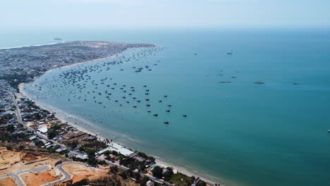 Aerial-pan-left-shot-of-Mui-ne-coastline-in-sunny-day,-Vietnam