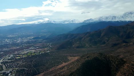 Aerial-orbit-of-the-foothills-at-Morro-Las-Papas,-Las-Condes,-Santiago,-Chile