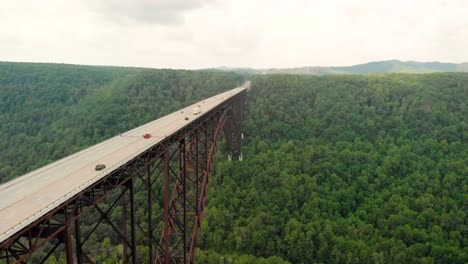 Overhead-parallax-aerial-drone-shot-of-New-River-Gorge-Bridge-in-Fayetteville,-WV