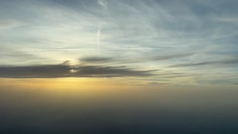 Hazy cirrostratus clouds in light blue sky Stock Photo