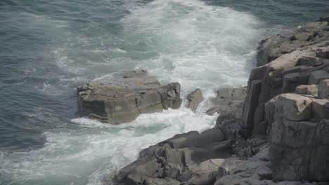 medium-daytime-exterior-of-waves-crashing-on-rocks