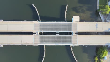 Aerial-view-of-cars-and-trucks-driving-over-a-drawbridge-just-after-it-closed