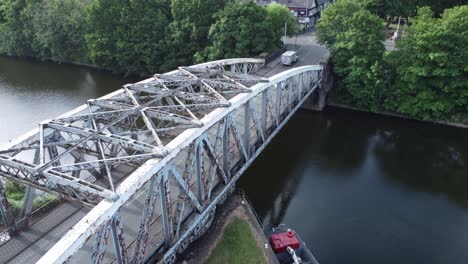 Aerial-view-vehicles-crossing-Manchester-ship-canal-Victorian-swing-bridge-Warrington-England