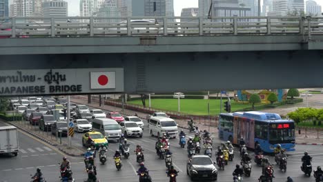 Motorbikes-and-cars-at-traffic-light