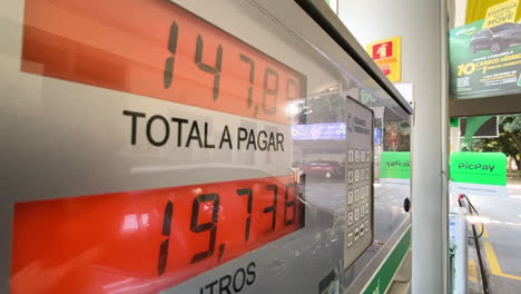 Close-up-shot-of-the-price-of-gas-on-the-pump-as-someone-is-filling-up-their-vehicle