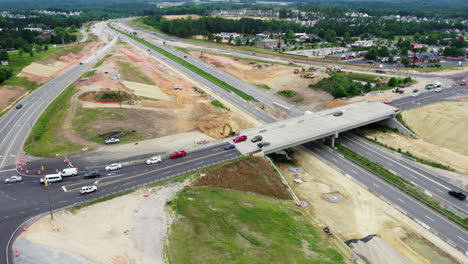 Drone-shot-of-new-bridge-construction-over-busy-highway
