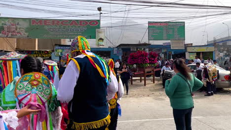 People-gathered-in-a-traditional-festival-at-hillside-road-in-Manchay,-Lima,-Peru