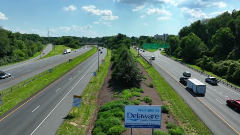 Descending-aerial-Welcome-to-Delaware-sign