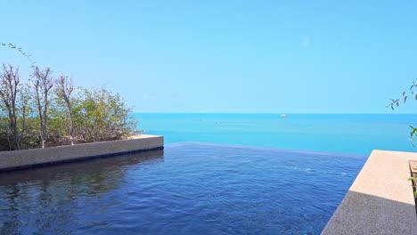 Empty-Luxury-Infinity-pool-on-rooftop,-vacation-template-no-people