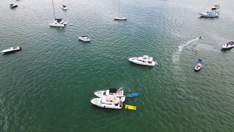People-on-Boats-During-Summer-on-Ocean-near-Miami,-Florida---Aerial