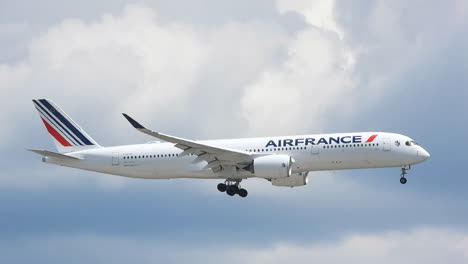 Air-France-airbus-A350-international-passenger-flight-on-approach-across-bright-blue-cloudy-sky