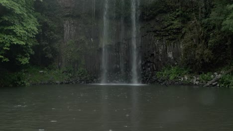 Millaa-Millaa-Falls-On-A-Rainy-Day-In-Queensland,-Australia---tilt-down-shot