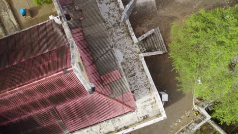Aerial-top-down-shot-of-the-old-abandoned-plantation-building-Landhuis-Hermanus-from-the-XIX-century