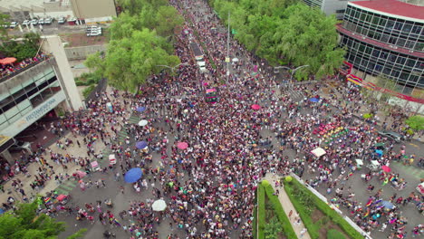 Aerial-Drone-View-Of-Pride-Parade-Crowds-In-Mexico-Walking-Along-Paseo-De-La-Reforma-On-25-June-2022