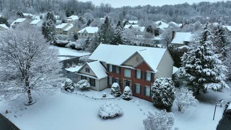 Modern-upscale-USA-residential-home-development-during-winter-snowstorm
