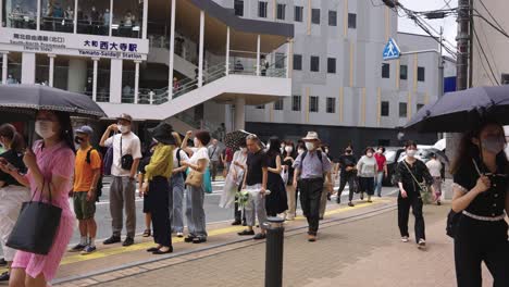 Yamato-Saidaiji-Station,-Japanese-People-Paying-Respects-to-Shinzo-Abe