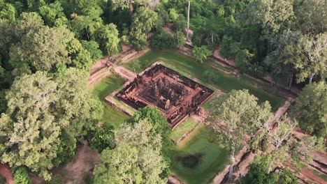 Angkor-temple-Aerial,-Banteay-Srei,-the-ladies-temple,-nested-in-the-mystic-Cambodian-jungle,-drone-rotation-footage-HD-crop
