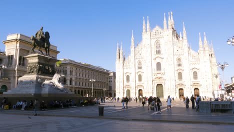 Milan,-Italy---May-03,-2021:-Crowd-of-tourists-in-the-square-in-front-of-the-Duomo-of-Milan,-Italy,-many-people-with-masks-to-protect-themselves-from-Covid-19-infection,-pandemic,-virus