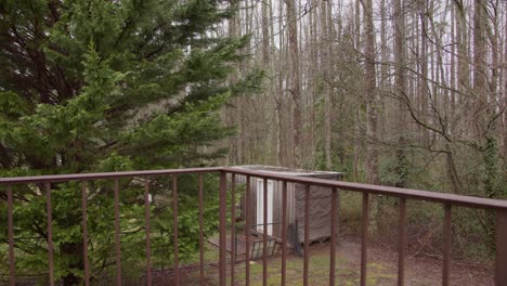 Medium-Shot-of-a-tree-and-shed-from-a-balcony