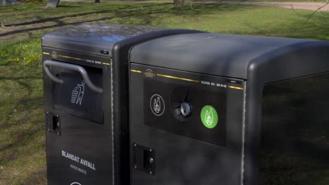 Closeup-Of-Garbage-And-Recycling-Bins,-Helping-Reduce-Environmental-Pollution-Issues