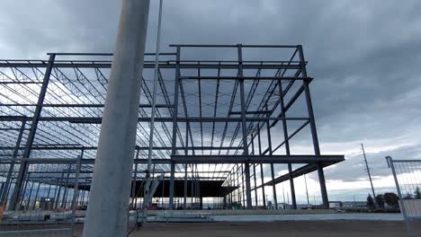 Construction-site,-skeleton-building-camera-on-slider-with-a-til-upwards