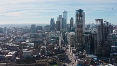 Cinematic-rotating-city-of-London-drone-shot-of-business-district-skyscrapers-bishopsgate