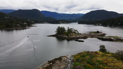 Aerial-drone-shot-of-boat-in-lake-near-Skardon-Islands-in-British-Columbia