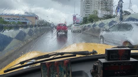 Forward-POV-driving-in-taxi-through-the-street-of-kolkata-on-a-Early-Saturday-Morning-in-a-rainy-day