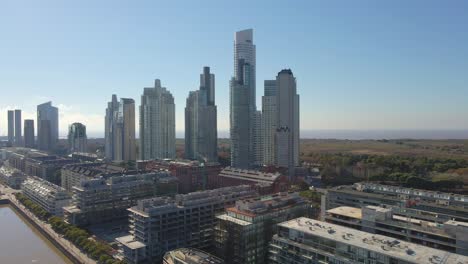 Aerial-establishing-shot-of-some-Puerto-Madero's-skypcrapers-with-blue-sky-as-background