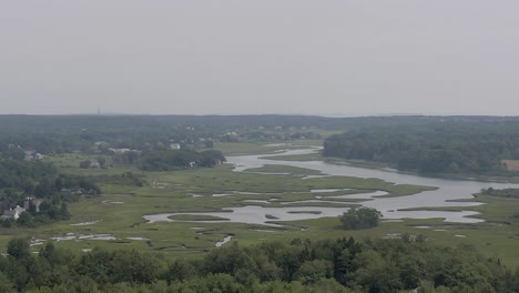 Drone-flying-over-marsh-in-Scarborough,-Maine