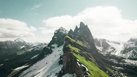 Majestic-mountain-ridge-partly-covered-in-snow-during-springtime