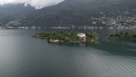 Aerial-orbit,-remote-island-Brissago,-tourist-attraction-in-Ticino,-Switzerland