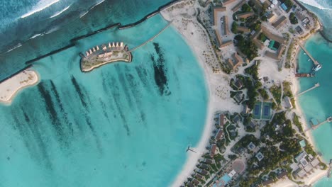 resort-blue-lagoon-white-sand-beach-maldives-scenery-at-sunset-over-the-water-villas