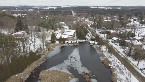 Aerial-Shot-Of-Alton-Mill-And-Surrounding-Houses-In-Beautiful-Village-During-Winter