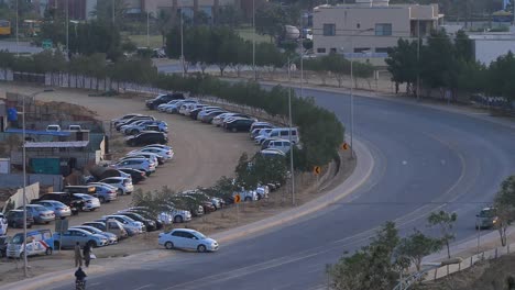 Row-Of-Cars-Parked-Beside-Curve-Of-Road-In-Bahria-Housing-Estate