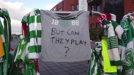 Close-up-of-a-Celtic-t-shirt-with-the-slogan,-"But-Can-They-Play