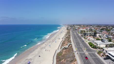 Aerial-shot-flying-over-the-coast-of-Carlsbad-city-in-Californian-summer