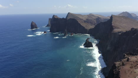 Waves-Crashing-In-Cliffside-Of-Ponto-do-Rosto-Madeira-Island-Portugal---aerial-shot