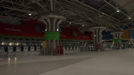 Pan-over-a-near-empty-ticketing-area-at-Fuji-Airport-in-Lisbon-Portugal