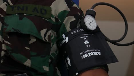 Yogyakarta,-Indonesia---Feb-26,-2022-:-Indonesian-army-is-being-checked-his-blood-pressure-before-donate-blood