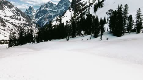 group-of-people-hiking-on-harsh-condition-through-mountains