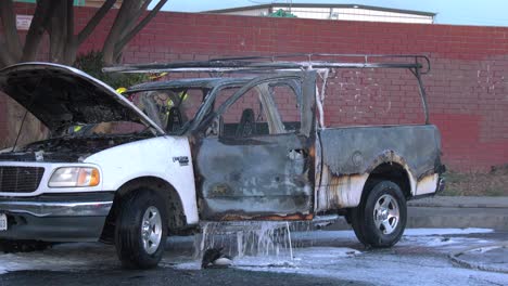 Truck-on-fire-with-firefighters-on-scene