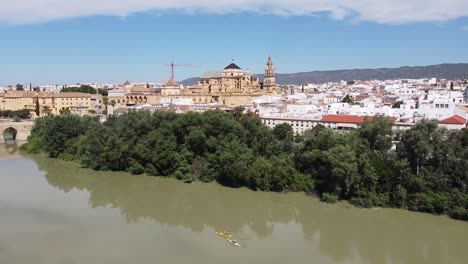 Cordoba,-Andalusia,-Spain---Aerial-Drone-View-of-the-Cityscape,-Mezquita-Mosque-Cathedral-and-river-Guadalquivir