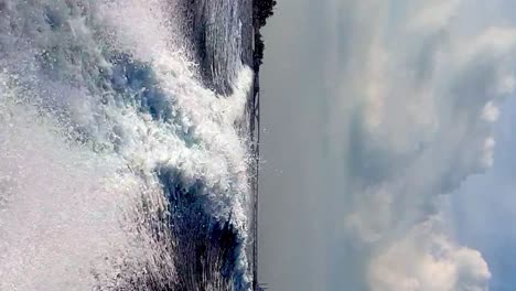 Extreme-low-angle-pov-of-speedboat-water-trail,-sea-level-view