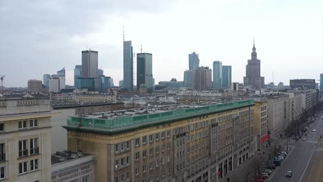 Aerial-view-over-traffic-on-the-Marshal-Street-and-Constitution-Square-in-Warsaw,-Poland---pull-back,-drone-shot