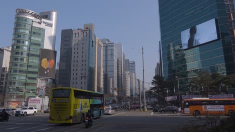 Seoul-busy-streets-with-many-cars-in-the-business-district-of-Gangnam-daytime-with-city-skyline-against-blue-sky